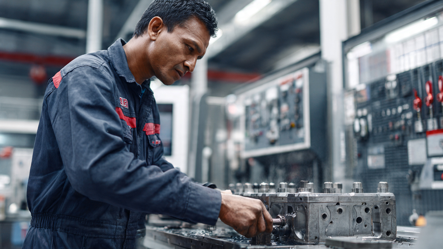 35 year old nepali male confidently calibrating a diesel (3)